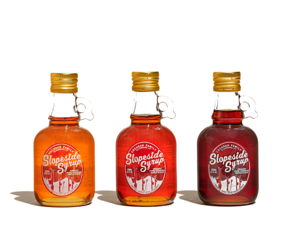 three 250ml bottles of slopeside syrup, one of each grade